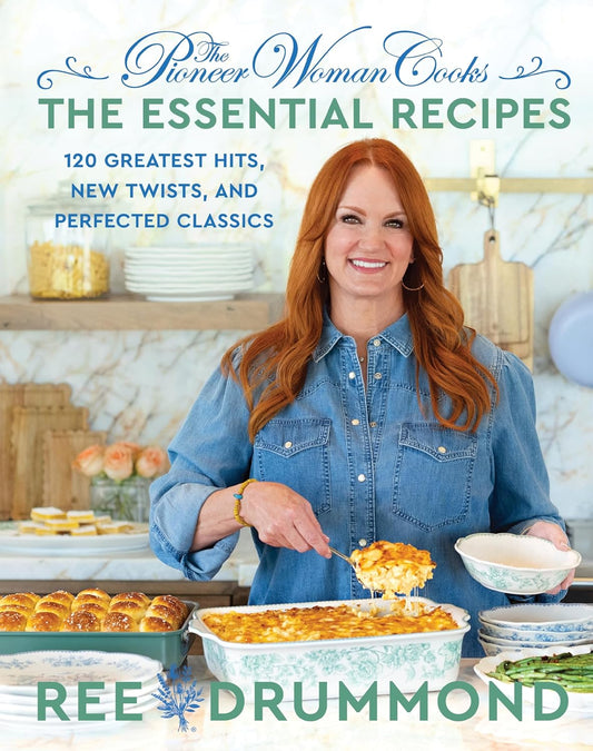 Cookbook cover featuring a woman holding a dish with food, surrounded by baked goods.