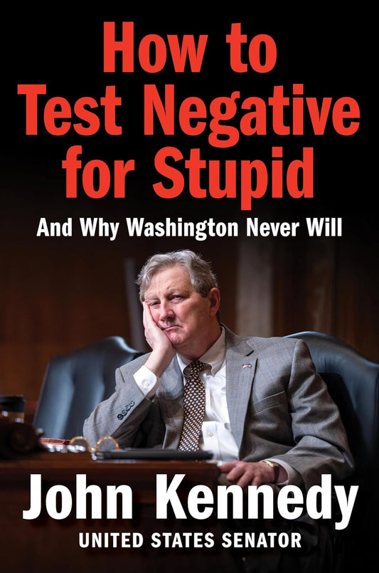 Book cover of 'How to Test Negative for Stupid' by John Kennedy with a man in a suit sitting at a desk.