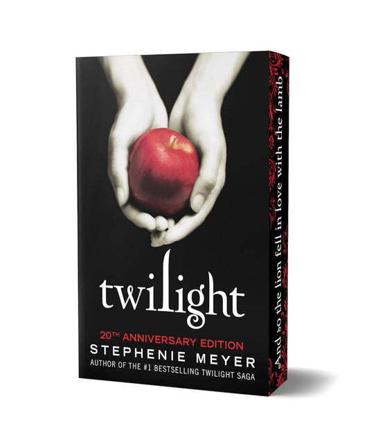 Book cover of 'Twilight' with hands holding an apple on a black background