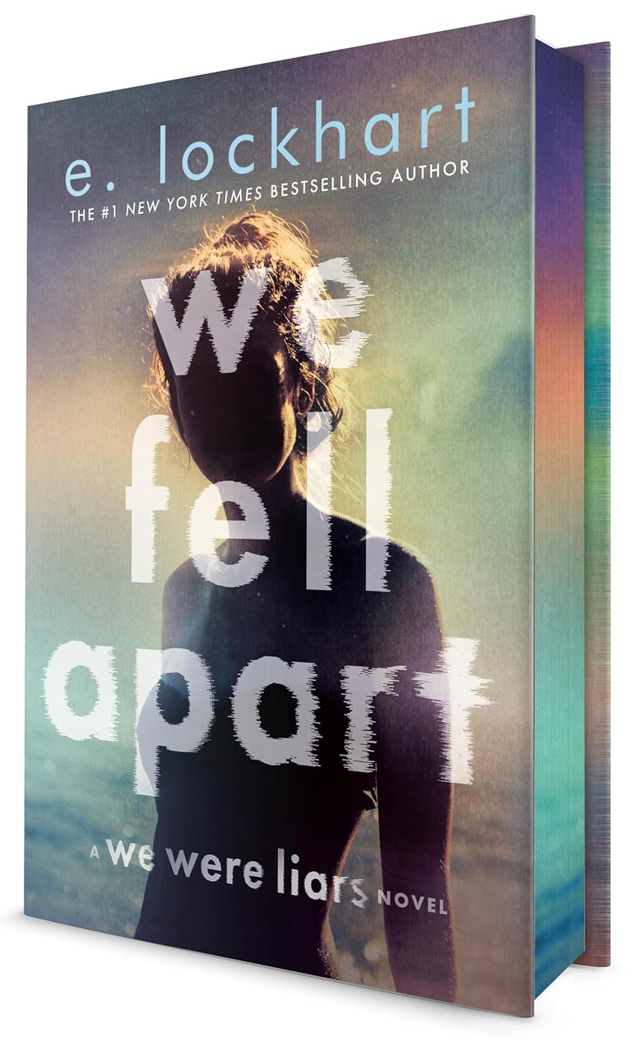 Book cover of 'We Fell Apart' by e. lockhart with a silhouette against a colorful background.