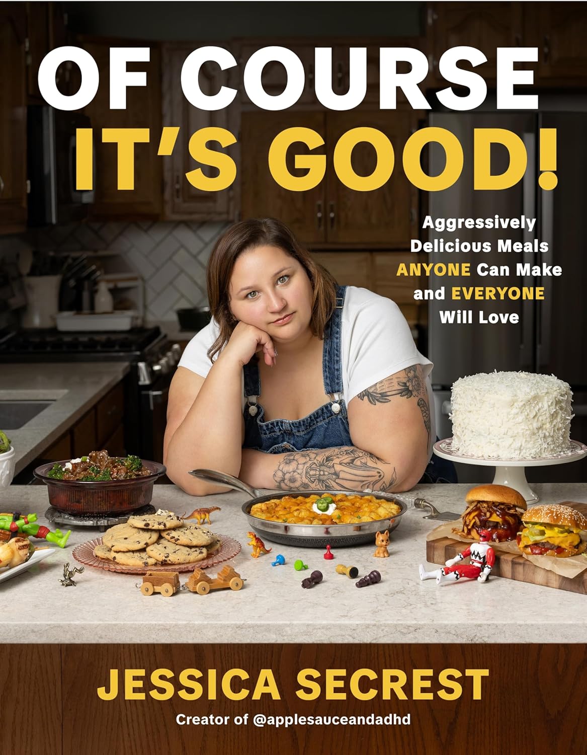 Book cover of 'Of Course It's Good!' with a woman in a kitchen surrounded by food.